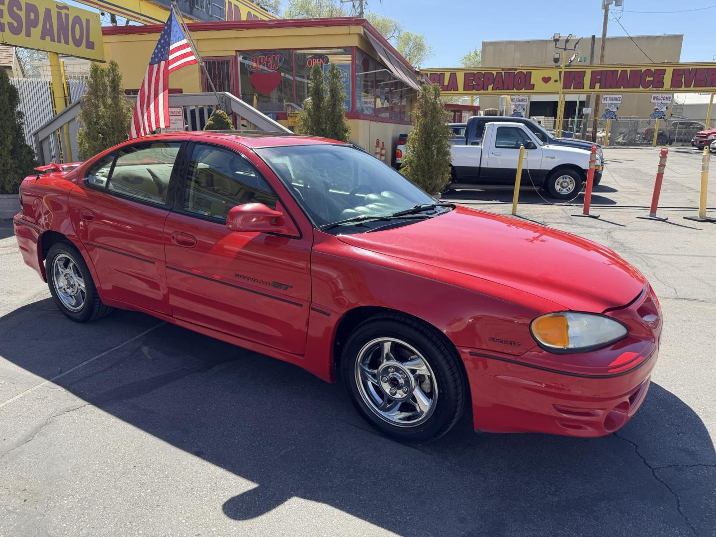 2002 Rallye Red /Black Pontiac Grand AM GT1 sedan (1G2NV52E02C) with an 3.4L V6 OHV 12V engine, 4-Speed Automatic Overdrive transmission, located at 801 South State Street, Salt Lake City, UT, 84111, (801) 328-0098, 40.751953, -111.888206 - Certified Carfax 1-Owner car!!! Clean title! No accidents on Carfax! Immaculate condition inside and out for the year. Hard to find this clean in this condition, vehicle has been meticulously maintained and cared for. Certified for up to a 5 year bumper warranty that can be added onto the vehicle, a - Photo#5