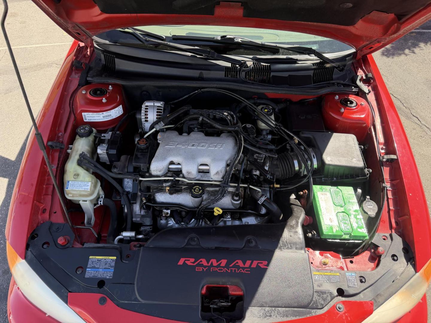 2002 Rallye Red /Black Pontiac Grand AM GT1 sedan (1G2NV52E02C) with an 3.4L V6 OHV 12V engine, 4-Speed Automatic Overdrive transmission, located at 801 South State Street, Salt Lake City, UT, 84111, (801) 328-0098, 40.751953, -111.888206 - Certified Carfax 1-Owner car!!! Clean title! No accidents on Carfax! Immaculate condition inside and out for the year. Hard to find this clean in this condition, vehicle has been meticulously maintained and cared for. Certified for up to a 5 year bumper warranty that can be added onto the vehicle, a - Photo#18