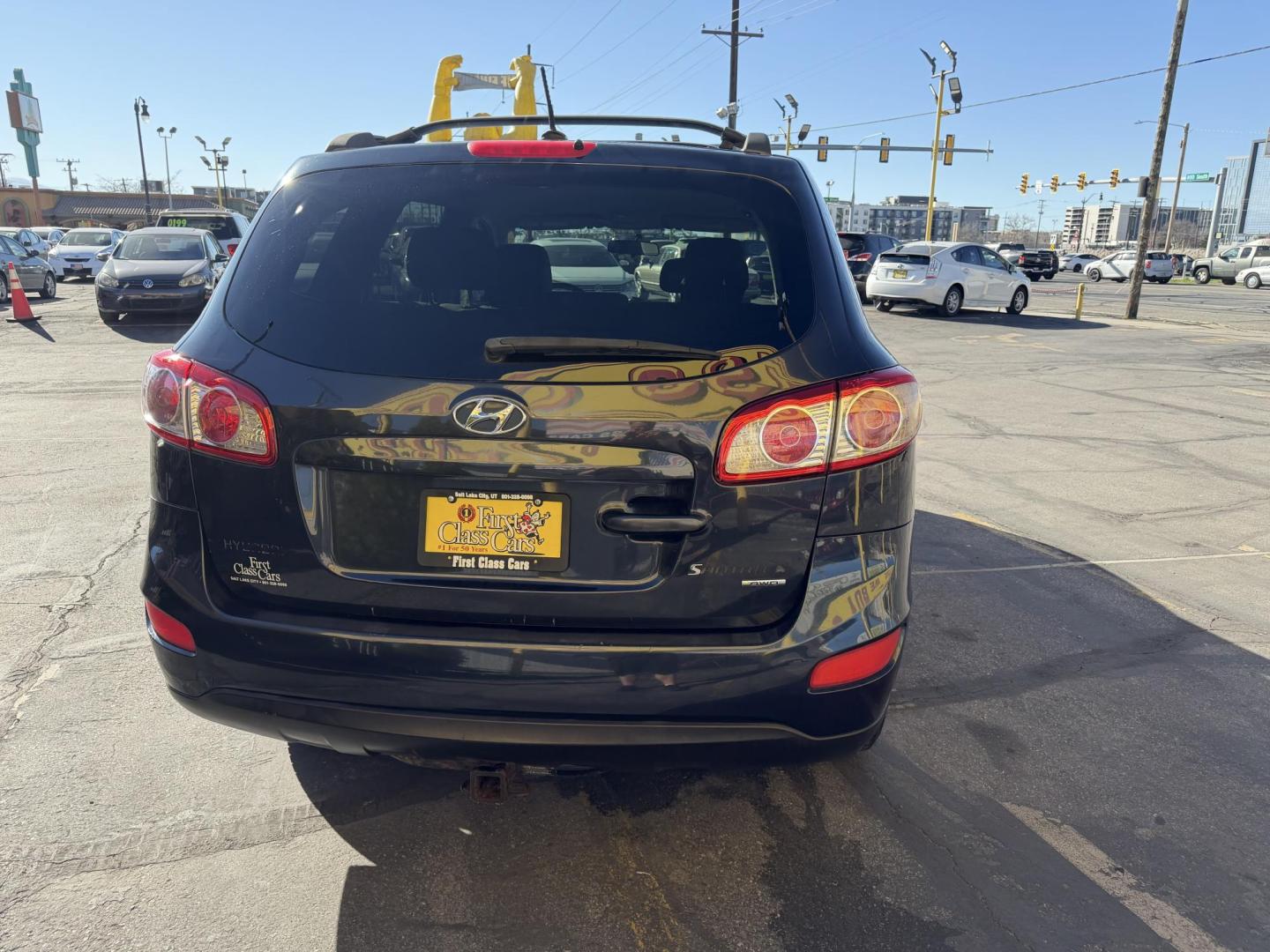 2011 Black /Gray Hyundai Santa Fe GL 2.4 4WD (5XYZGDAB3BG) with an 2.4L L4 DOHC 16V engine, 6-Speed Automatic transmission, located at 801 South State Street, Salt Lake City, UT, 84111, (801) 328-0098, 40.751953, -111.888206 - We put all 4 Brand new Tires! Clean title!!! Approved for up to a 5 year bumper warranty through Protective that can be added onto the vehicle. Great fuel economy this is a fuel efficient SUV at an affordable price hard to find. Features: 4WD/AWD, ABS Brakes, Air Conditioning, Alloy Wheels, AM/FM S - Photo#11