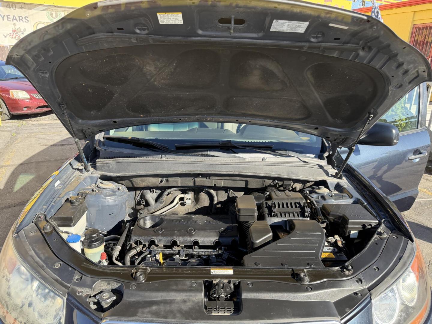 2011 Black /Gray Hyundai Santa Fe GL 2.4 4WD (5XYZGDAB3BG) with an 2.4L L4 DOHC 16V engine, 6-Speed Automatic transmission, located at 801 South State Street, Salt Lake City, UT, 84111, (801) 328-0098, 40.751953, -111.888206 - We put all 4 Brand new Tires! Clean title!!! Approved for up to a 5 year bumper warranty through Protective that can be added onto the vehicle. Great fuel economy this is a fuel efficient SUV at an affordable price hard to find. Features: 4WD/AWD, ABS Brakes, Air Conditioning, Alloy Wheels, AM/FM S - Photo#26