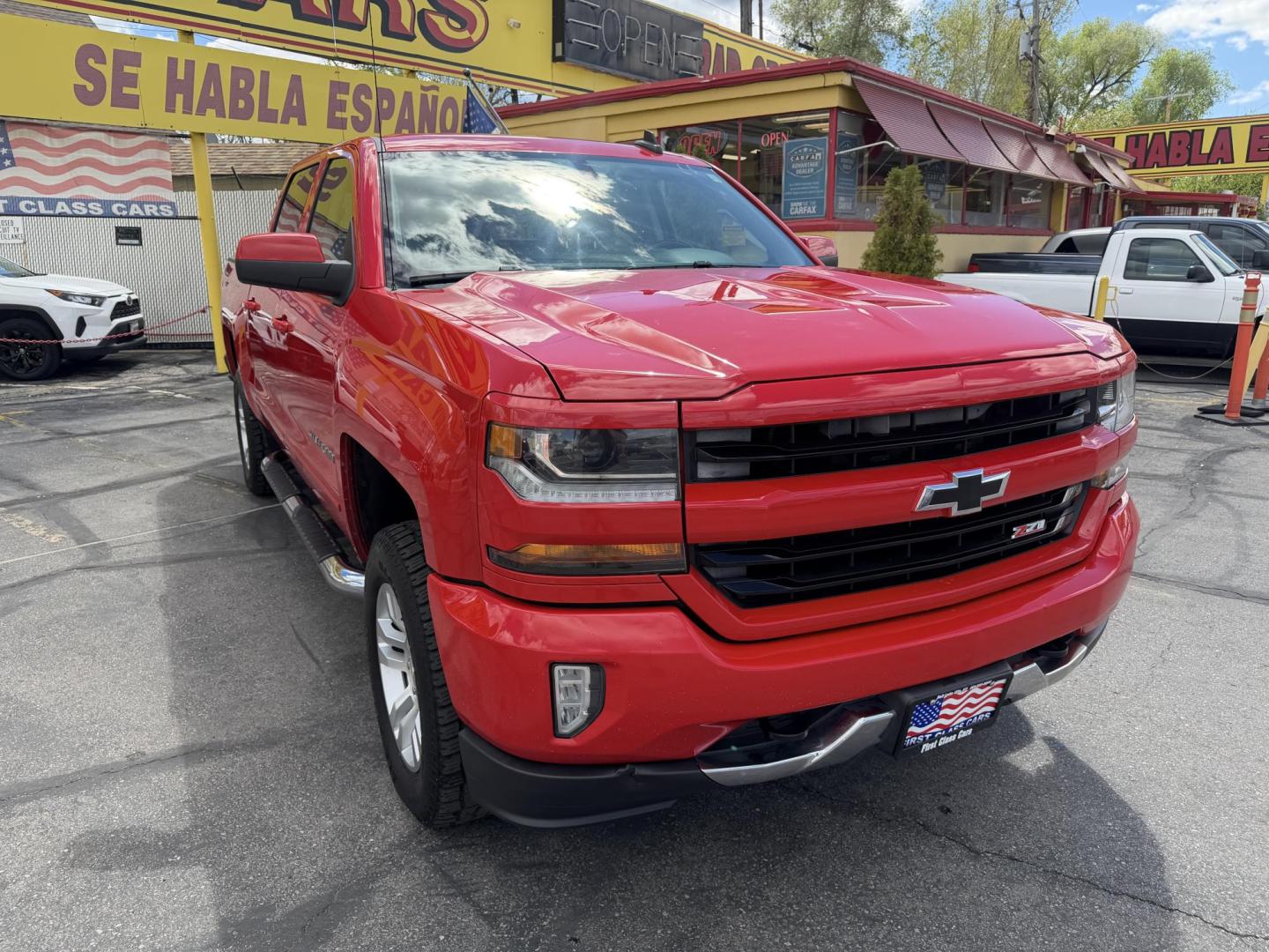2016 Rallye Red /Black Chevrolet Silverado 1500 LT Crew Cab 4WD (3GCUKREC3GG) with an 5.3L V8 OHV 16V engine, 6A transmission, located at 801 South State Street, Salt Lake City, UT, 84111, (801) 328-0098, 40.751953, -111.888206 - Wow this one is Super Clean Carfax certified 1-owner. It is immaculate inside and out not a scratch on it. Excellent condition. This is a perfect truck for anyone looking for a clean affordable price range for a Silverado with the Offroad Z71 package. This truck has been checked out by a certified m - Photo#5