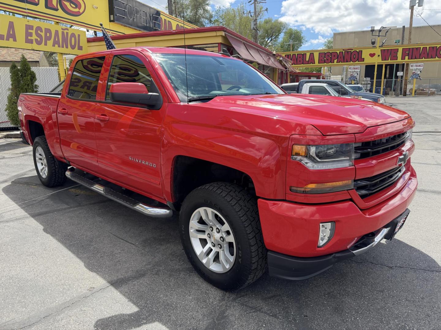 2016 Rallye Red /Black Chevrolet Silverado 1500 LT Crew Cab 4WD (3GCUKREC3GG) with an 5.3L V8 OHV 16V engine, 6A transmission, located at 801 South State Street, Salt Lake City, UT, 84111, (801) 328-0098, 40.751953, -111.888206 - Wow this one is Super Clean Carfax certified 1-owner. It is immaculate inside and out not a scratch on it. Excellent condition. This is a perfect truck for anyone looking for a clean affordable price range for a Silverado with the Offroad Z71 package. This truck has been checked out by a certified m - Photo#6