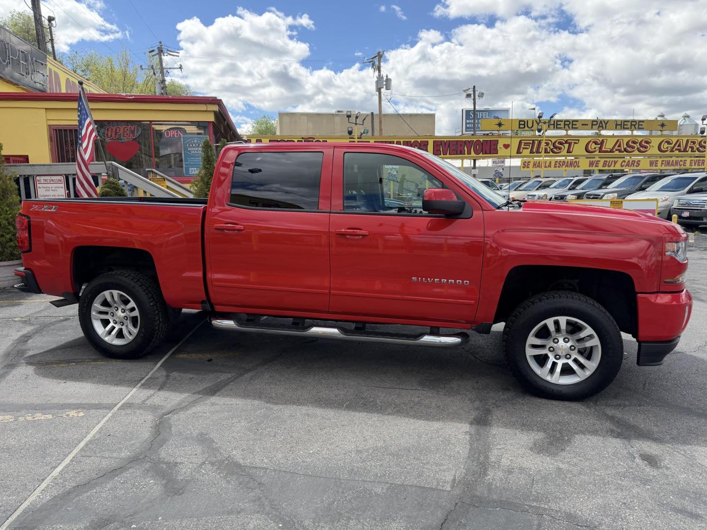 2016 Rallye Red /Black Chevrolet Silverado 1500 LT Crew Cab 4WD (3GCUKREC3GG) with an 5.3L V8 OHV 16V engine, 6A transmission, located at 801 South State Street, Salt Lake City, UT, 84111, (801) 328-0098, 40.751953, -111.888206 - Wow this one is Super Clean Carfax certified 1-owner. It is immaculate inside and out not a scratch on it. Excellent condition. This is a perfect truck for anyone looking for a clean affordable price range for a Silverado with the Offroad Z71 package. This truck has been checked out by a certified m - Photo#7