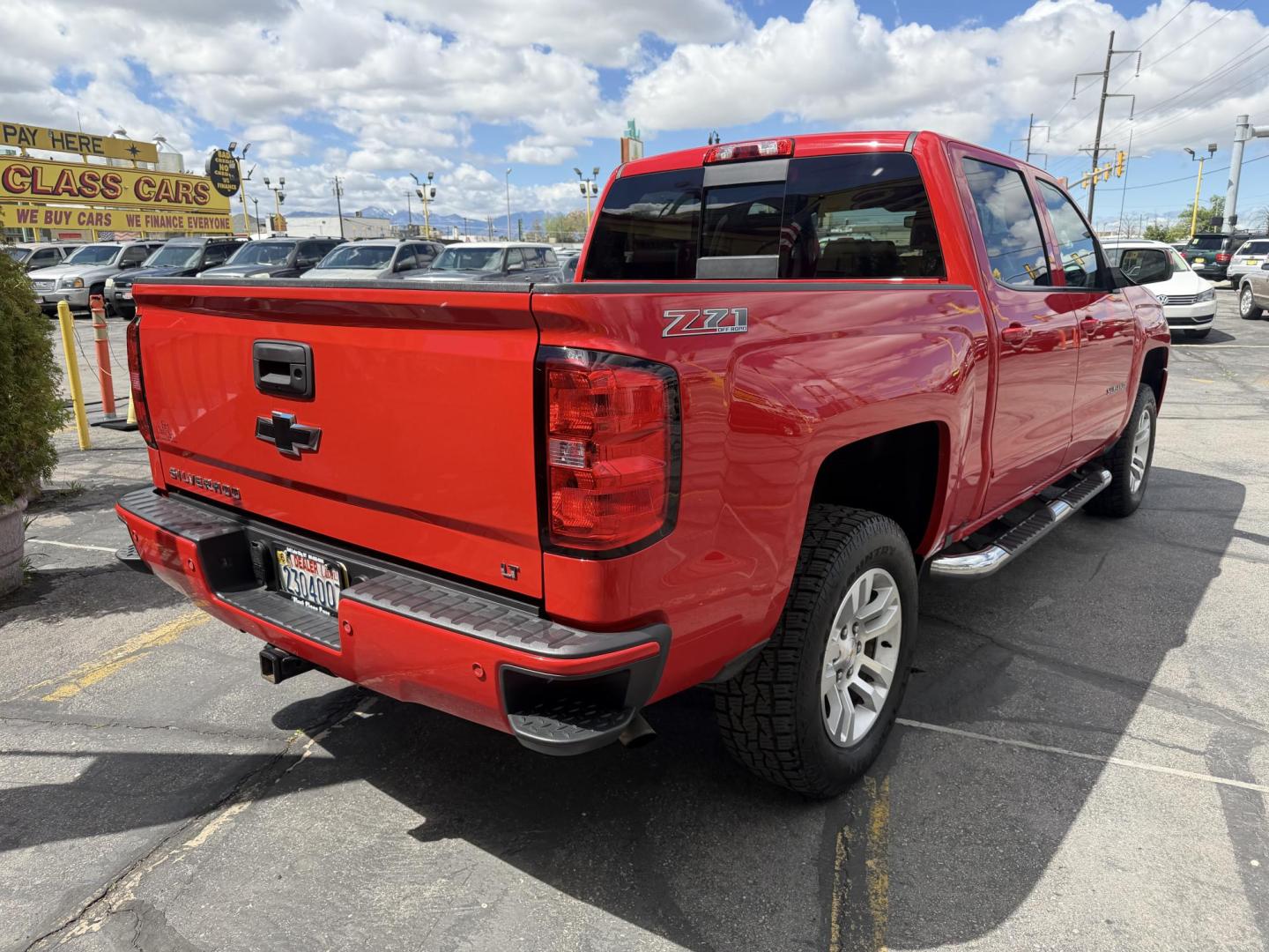 2016 Rallye Red /Black Chevrolet Silverado 1500 LT Crew Cab 4WD (3GCUKREC3GG) with an 5.3L V8 OHV 16V engine, 6A transmission, located at 801 South State Street, Salt Lake City, UT, 84111, (801) 328-0098, 40.751953, -111.888206 - Wow this one is Super Clean Carfax certified 1-owner. It is immaculate inside and out not a scratch on it. Excellent condition. This is a perfect truck for anyone looking for a clean affordable price range for a Silverado with the Offroad Z71 package. This truck has been checked out by a certified m - Photo#9