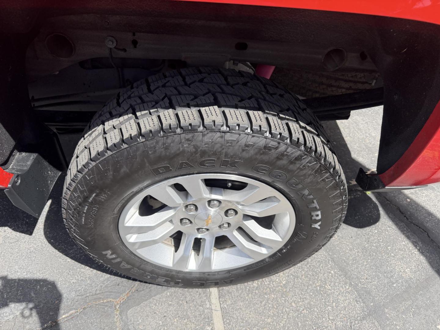 2016 Rallye Red /Black Chevrolet Silverado 1500 LT Crew Cab 4WD (3GCUKREC3GG) with an 5.3L V8 OHV 16V engine, 6A transmission, located at 801 South State Street, Salt Lake City, UT, 84111, (801) 328-0098, 40.751953, -111.888206 - Wow this one is Super Clean Carfax certified 1-owner. It is immaculate inside and out not a scratch on it. Excellent condition. This is a perfect truck for anyone looking for a clean affordable price range for a Silverado with the Offroad Z71 package. This truck has been checked out by a certified m - Photo#17