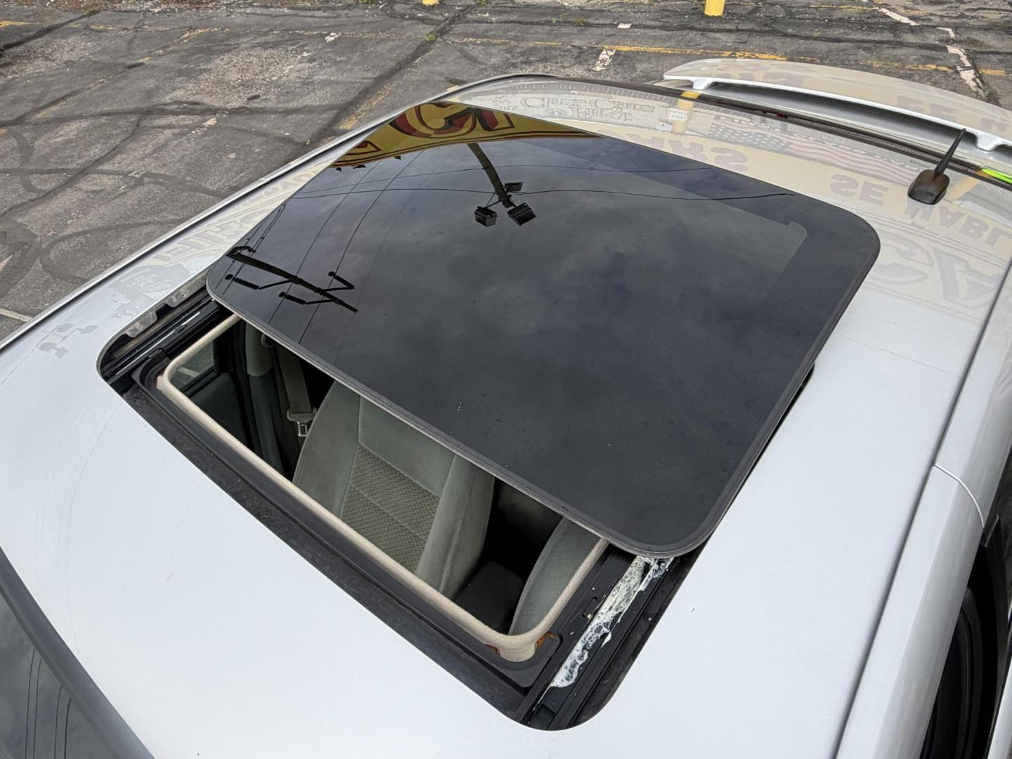 2007 Silver Sky Metallic /Gray Saturn ION 3 Sedan Automatic (1G8AL58B77Z) with an 2.4L L4 DOHC 16V engine, 4-Speed Automatic transmission, located at 801 South State Street, Salt Lake City, UT, 84111, (801) 328-0098, 40.751953, -111.888206 - Wow super low miles only 75,541 that is almost next to impossible to find on a 2007 these days. This was a 1-owner car that got traded in to a new car dealer the dealer that took it in on trade was reported as a new owner even though it wasn't because they issued the title in their name so really it - Photo#20