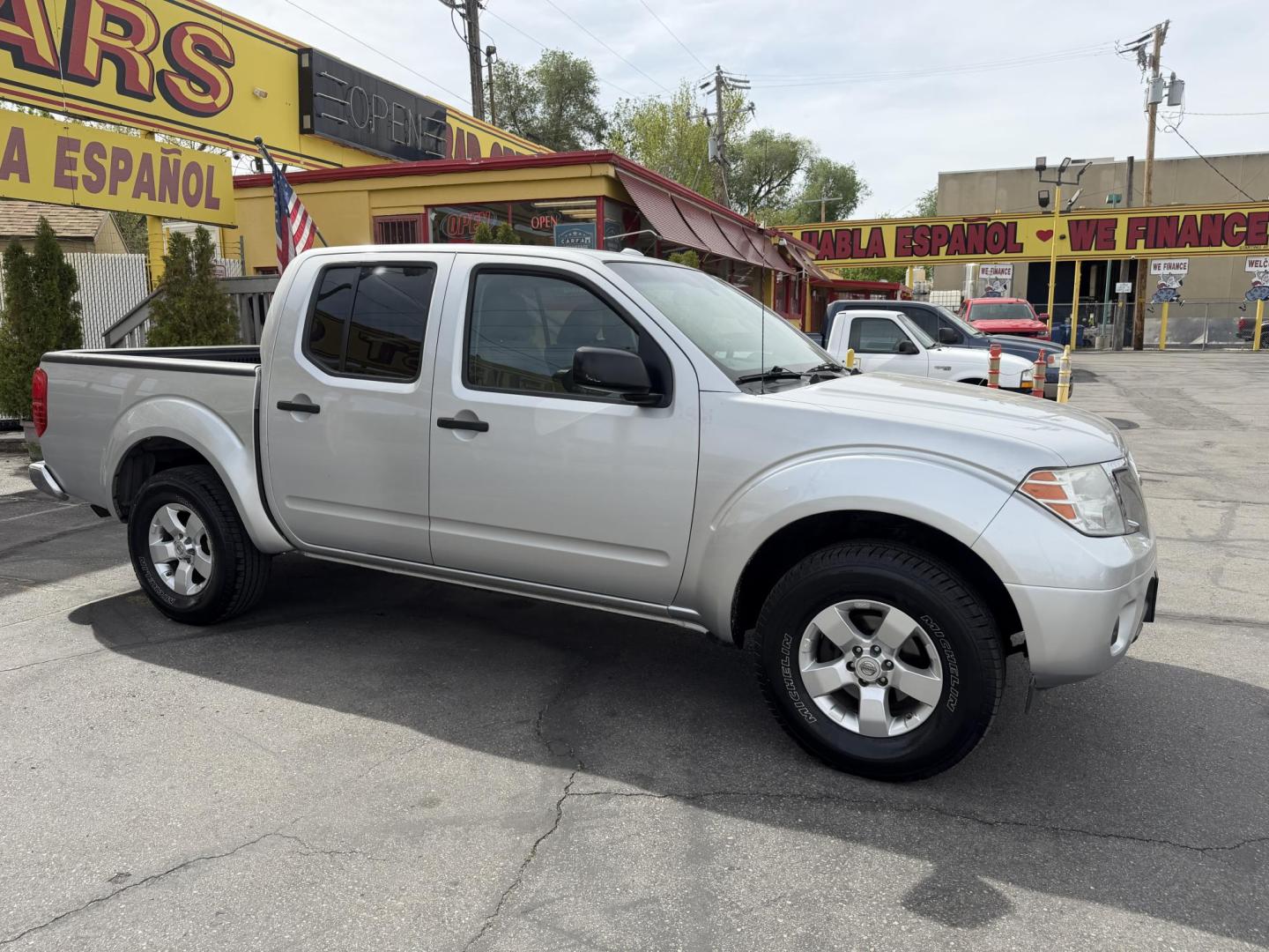 2013 Sunlight Silver Metallic /Gray Nissan Frontier SL Crew Cab 4WD (1N6AD0EV9DN) with an 4.0L V6 DOHC 24V engine, 5-Speed Automatic transmission, located at 801 South State Street, Salt Lake City, UT, 84111, (801) 328-0098, 40.751953, -111.888206 - Clean title! Carfax 2 owners only. Hard to find clean truck in excellent condition!!! Must see comes in 4x4 and showing regular service and maintenance was done on the Carfax! Approved for up to a 5 year warranty that can be purchased that covers bumper to bumper powertrain protection. Features: 4 - Photo#5