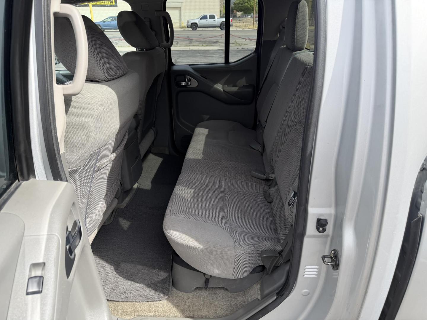 2013 Sunlight Silver Metallic /Gray Nissan Frontier SL Crew Cab 4WD (1N6AD0EV9DN) with an 4.0L V6 DOHC 24V engine, 5-Speed Automatic transmission, located at 801 South State Street, Salt Lake City, UT, 84111, (801) 328-0098, 40.751953, -111.888206 - Clean title! Carfax 2 owners only. Hard to find clean truck in excellent condition!!! Must see comes in 4x4 and showing regular service and maintenance was done on the Carfax! Approved for up to a 5 year warranty that can be purchased that covers bumper to bumper powertrain protection. Features: 4 - Photo#16