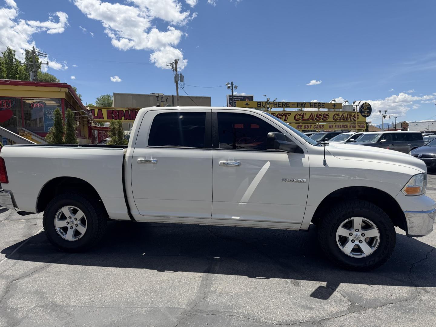 2009 Super White /Tan Dodge Ram 1500 SLT Crew Cab 4WD (1D3HV13P49S) with an 4.7L V8 SOHC 16V FFV engine, 5-Speed Automatic transmission, located at 801 South State Street, Salt Lake City, UT, 84111, (801) 328-0098, 40.751953, -111.888206 - Seats up to 6 People! Folding Armrest! Clean Title! Clean Carfax! Carfax shows regular service was performed and maintained. Nice affordable 4x4 truck great summer time truck for towing or winter truck for 4x4 as well! Passed all inspections already by a certified mechanic and has been approved for - Photo#6