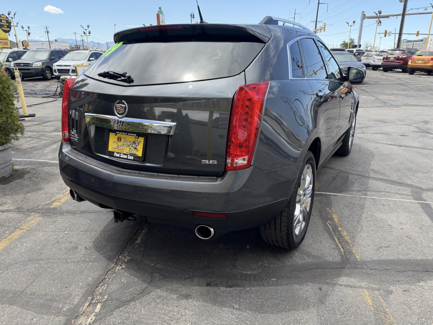 2012 Sterling Gray Metallic /Black Cadillac SRX Premium (3GYFNCE38CS) with an 3.6L V6 DOHC 24V FFV engine, 6-Speed Automatic transmission, located at 801 South State Street, Salt Lake City, UT, 84111, (801) 328-0098, 40.751953, -111.888206 - Clean Title! Clean Carfax! Carfax shows no accidents and regular service was performed and maintained. Beautiful 2012 Cadillac SRX Premium loaded with luxury options and comfort features! Great luxury SUV for commuting, road trips, or winter driving with plenty of space and premium styling. Passed a - Photo#7