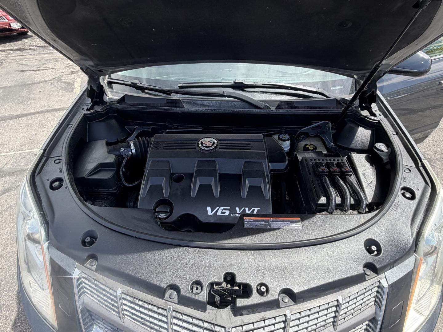 2012 Sterling Gray Metallic /Black Cadillac SRX Premium (3GYFNCE38CS) with an 3.6L V6 DOHC 24V FFV engine, 6-Speed Automatic transmission, located at 801 South State Street, Salt Lake City, UT, 84111, (801) 328-0098, 40.751953, -111.888206 - Clean Title! Clean Carfax! Carfax shows no accidents and regular service was performed and maintained. Beautiful 2012 Cadillac SRX Premium loaded with luxury options and comfort features! Great luxury SUV for commuting, road trips, or winter driving with plenty of space and premium styling. Passed a - Photo#31