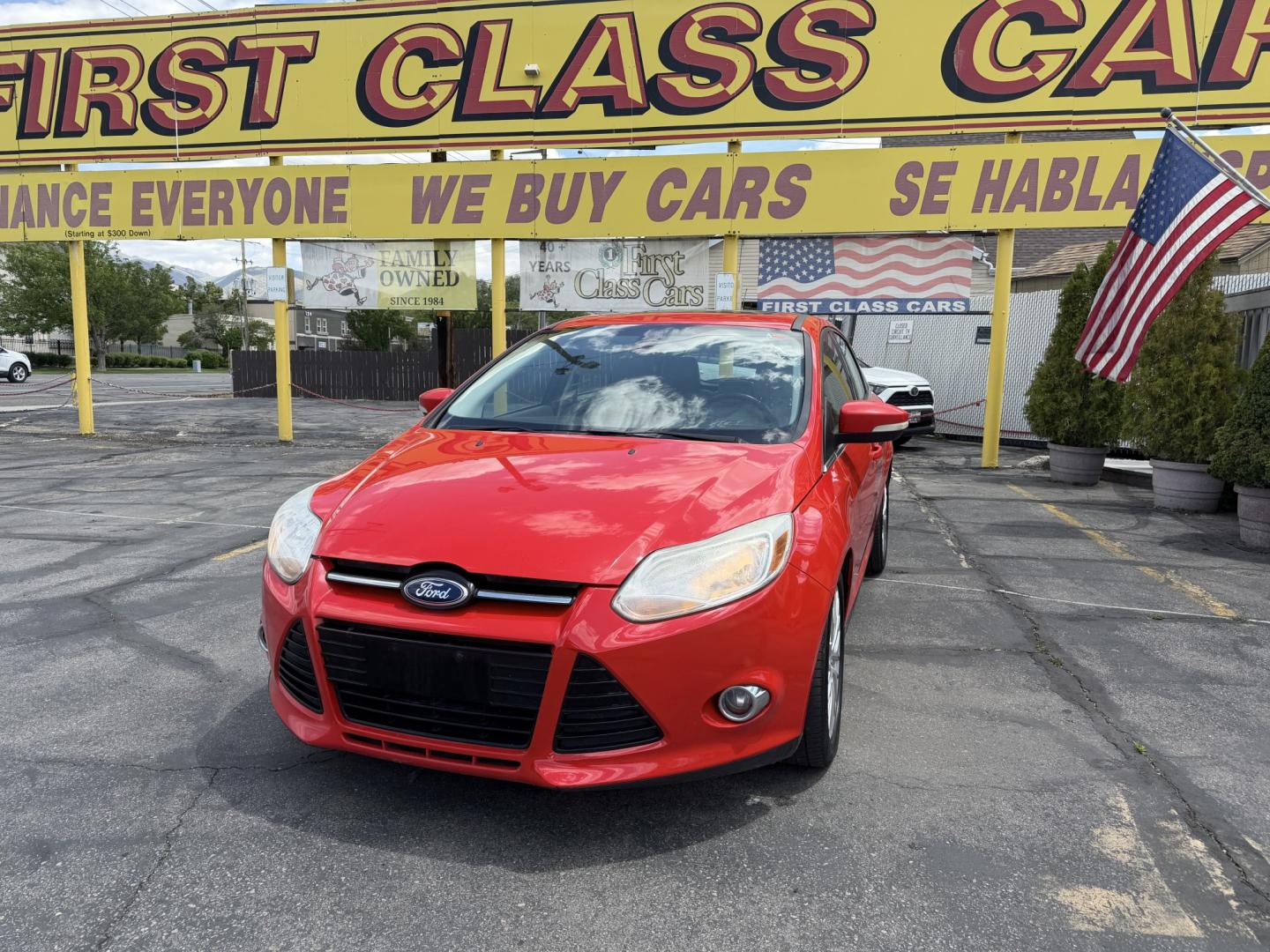 2012 Salsa Red Pearl /Tan Ford Focus SEL (1FAHP3M21CL) with an 2.0L L4 DOHC 16V engine, 6-Speed Automatic transmission, located at 801 South State Street, Salt Lake City, UT, 84111, (801) 328-0098, 40.751953, -111.888206 - Clean Title! Clean Carfax! Carfax shows only 2 previous owners and regular service was performed and maintained. Nice reliable and fuel efficient 2012 Ford Focus SEL with the dependable 2.0L 4 Cylinder engine! Great commuter car, first car, or affordable daily driver with a comfortable interior and - Photo#1