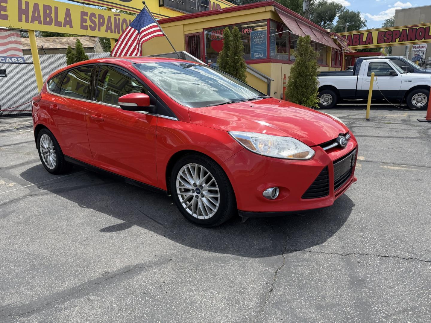 2012 Salsa Red Pearl /Tan Ford Focus SEL (1FAHP3M21CL) with an 2.0L L4 DOHC 16V engine, 6-Speed Automatic transmission, located at 801 South State Street, Salt Lake City, UT, 84111, (801) 328-0098, 40.751953, -111.888206 - Clean Title! Clean Carfax! Carfax shows only 2 previous owners and regular service was performed and maintained. Nice reliable and fuel efficient 2012 Ford Focus SEL with the dependable 2.0L 4 Cylinder engine! Great commuter car, first car, or affordable daily driver with a comfortable interior and - Photo#3