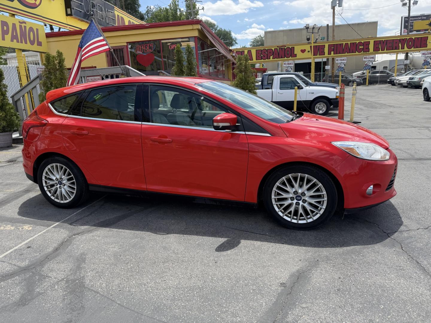 2012 Salsa Red Pearl /Tan Ford Focus SEL (1FAHP3M21CL) with an 2.0L L4 DOHC 16V engine, 6-Speed Automatic transmission, located at 801 South State Street, Salt Lake City, UT, 84111, (801) 328-0098, 40.751953, -111.888206 - Clean Title! Clean Carfax! Carfax shows only 2 previous owners and regular service was performed and maintained. Nice reliable and fuel efficient 2012 Ford Focus SEL with the dependable 2.0L 4 Cylinder engine! Great commuter car, first car, or affordable daily driver with a comfortable interior and - Photo#4