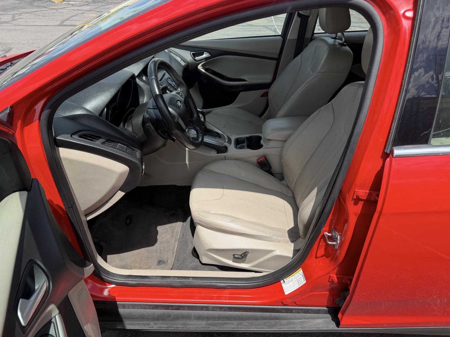 2012 Salsa Red Pearl /Tan Ford Focus SEL (1FAHP3M21CL) with an 2.0L L4 DOHC 16V engine, 6-Speed Automatic transmission, located at 801 South State Street, Salt Lake City, UT, 84111, (801) 328-0098, 40.751953, -111.888206 - Clean Title! Clean Carfax! Carfax shows only 2 previous owners and regular service was performed and maintained. Nice reliable and fuel efficient 2012 Ford Focus SEL with the dependable 2.0L 4 Cylinder engine! Great commuter car, first car, or affordable daily driver with a comfortable interior and - Photo#11
