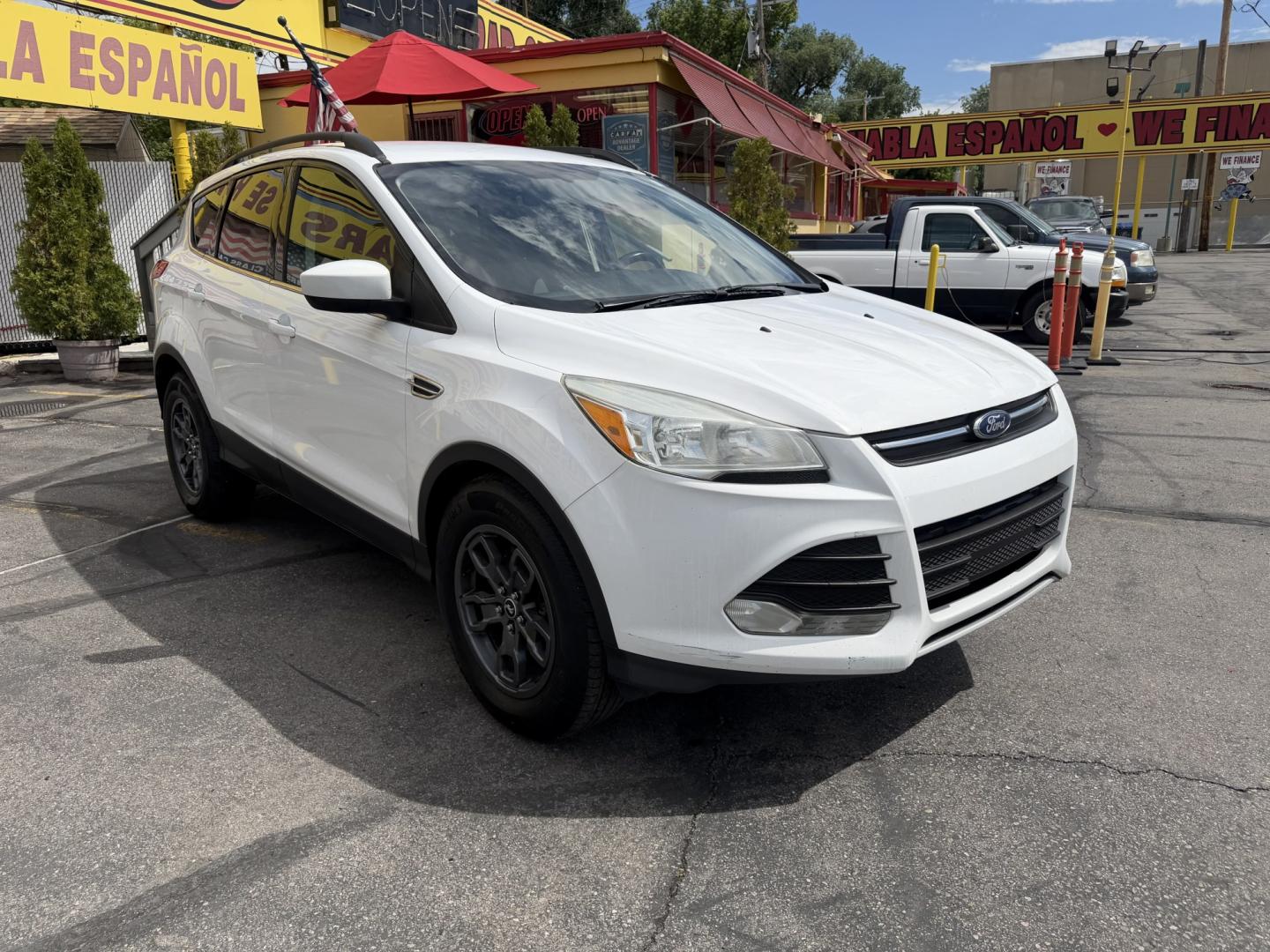 2015 Super White /Black Ford Escape SE 4WD (1FMCU9G93FU) with an 2.0L L4 DOHC 16V engine, 6-Speed Automatic transmission, located at 801 South State Street, Salt Lake City, UT, 84111, (801) 328-0098, 40.751953, -111.888206 - Clean Title! Clean Carfax! Carfax shows no accidents and only 3 previous owners. Nice dependable and fuel efficient 2015 Ford Escape SE 4x4 with the powerful turbo charged engine! Great SUV for commuting, road trips, family driving, or winter weather with plenty of cargo space and comfortable seatin - Photo#3
