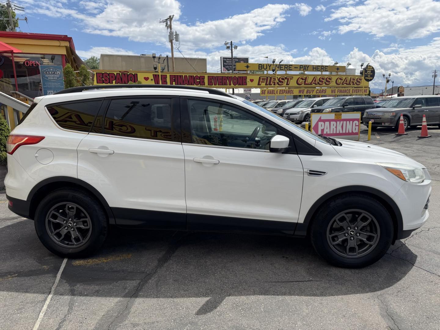 2015 Super White /Black Ford Escape SE 4WD (1FMCU9G93FU) with an 2.0L L4 DOHC 16V engine, 6-Speed Automatic transmission, located at 801 South State Street, Salt Lake City, UT, 84111, (801) 328-0098, 40.751953, -111.888206 - Clean Title! Clean Carfax! Carfax shows no accidents and only 3 previous owners. Nice dependable and fuel efficient 2015 Ford Escape SE 4x4 with the powerful turbo charged engine! Great SUV for commuting, road trips, family driving, or winter weather with plenty of cargo space and comfortable seatin - Photo#4
