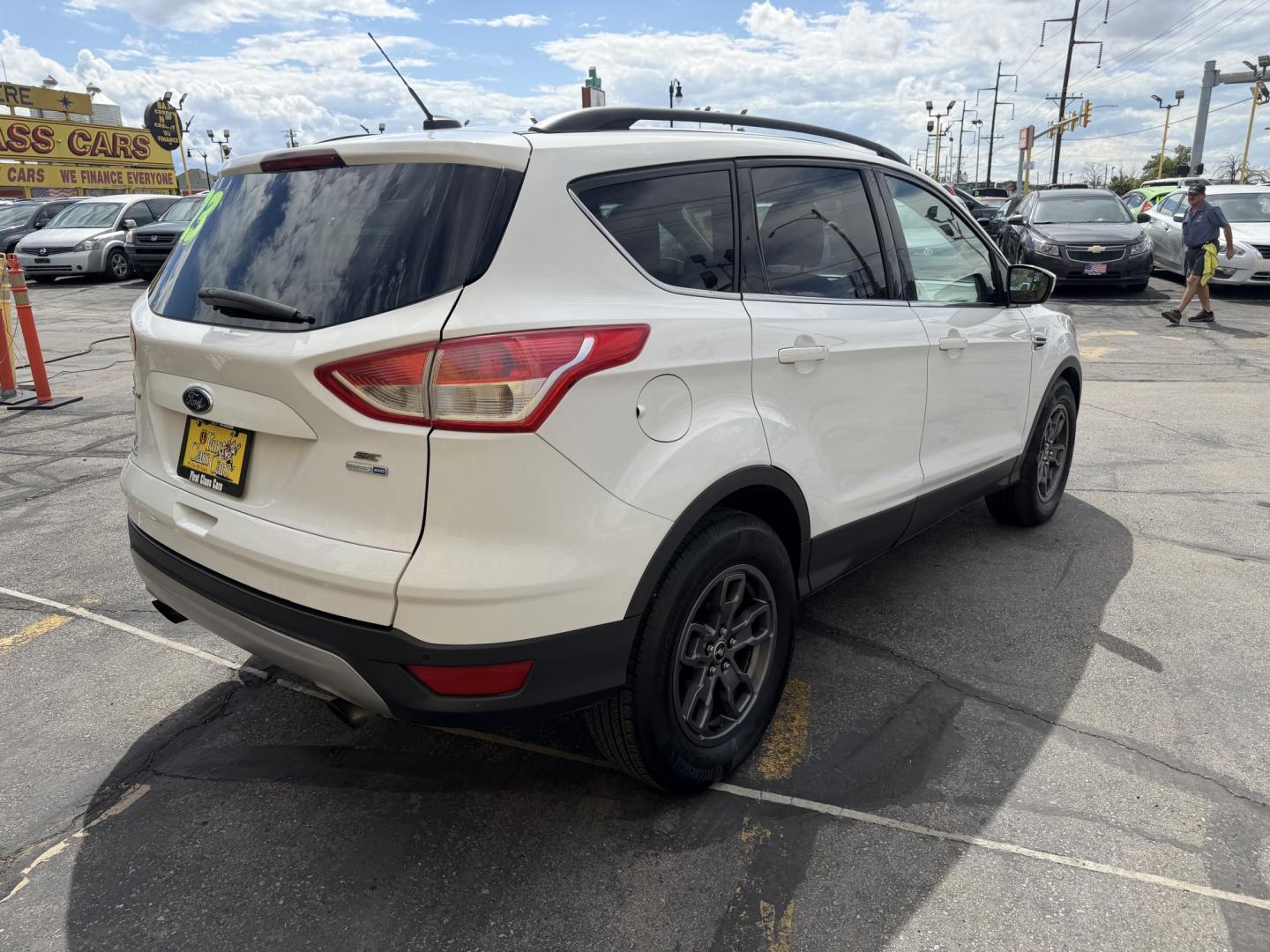 2015 Super White /Black Ford Escape SE 4WD (1FMCU9G93FU) with an 2.0L L4 DOHC 16V engine, 6-Speed Automatic transmission, located at 801 South State Street, Salt Lake City, UT, 84111, (801) 328-0098, 40.751953, -111.888206 - Clean Title! Clean Carfax! Carfax shows no accidents and only 3 previous owners. Nice dependable and fuel efficient 2015 Ford Escape SE 4x4 with the powerful turbo charged engine! Great SUV for commuting, road trips, family driving, or winter weather with plenty of cargo space and comfortable seatin - Photo#5