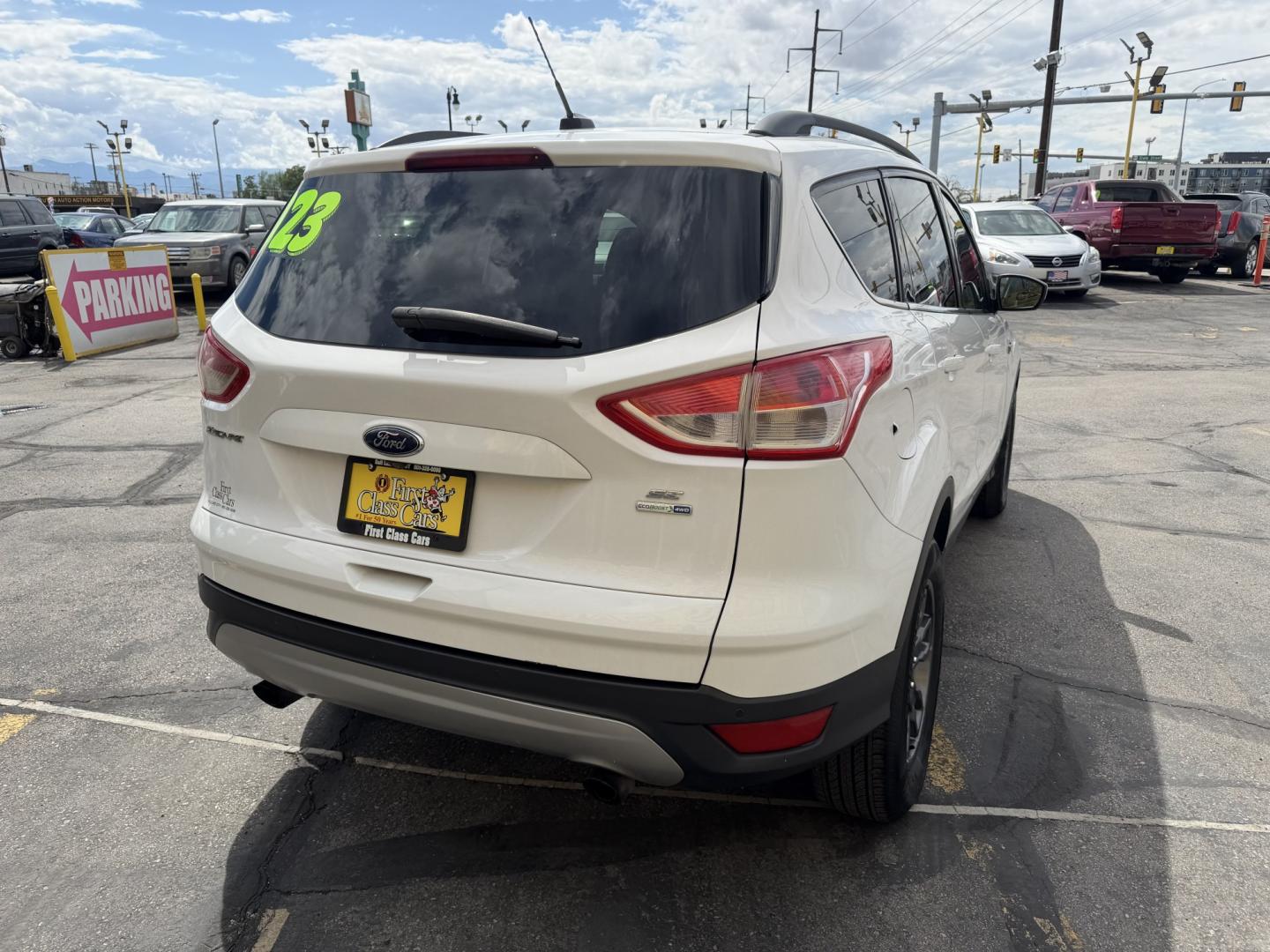 2015 Super White /Black Ford Escape SE 4WD (1FMCU9G93FU) with an 2.0L L4 DOHC 16V engine, 6-Speed Automatic transmission, located at 801 South State Street, Salt Lake City, UT, 84111, (801) 328-0098, 40.751953, -111.888206 - Clean Title! Clean Carfax! Carfax shows no accidents and only 3 previous owners. Nice dependable and fuel efficient 2015 Ford Escape SE 4x4 with the powerful turbo charged engine! Great SUV for commuting, road trips, family driving, or winter weather with plenty of cargo space and comfortable seatin - Photo#6