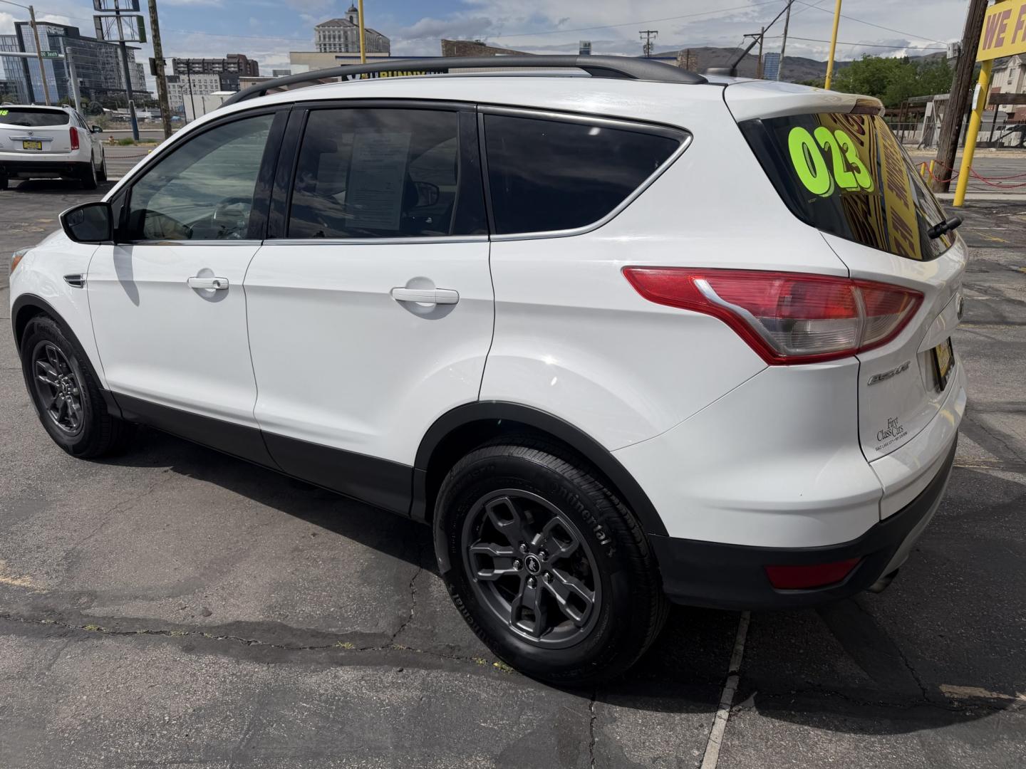 2015 Super White /Black Ford Escape SE 4WD (1FMCU9G93FU) with an 2.0L L4 DOHC 16V engine, 6-Speed Automatic transmission, located at 801 South State Street, Salt Lake City, UT, 84111, (801) 328-0098, 40.751953, -111.888206 - Clean Title! Clean Carfax! Carfax shows no accidents and only 3 previous owners. Nice dependable and fuel efficient 2015 Ford Escape SE 4x4 with the powerful turbo charged engine! Great SUV for commuting, road trips, family driving, or winter weather with plenty of cargo space and comfortable seatin - Photo#9