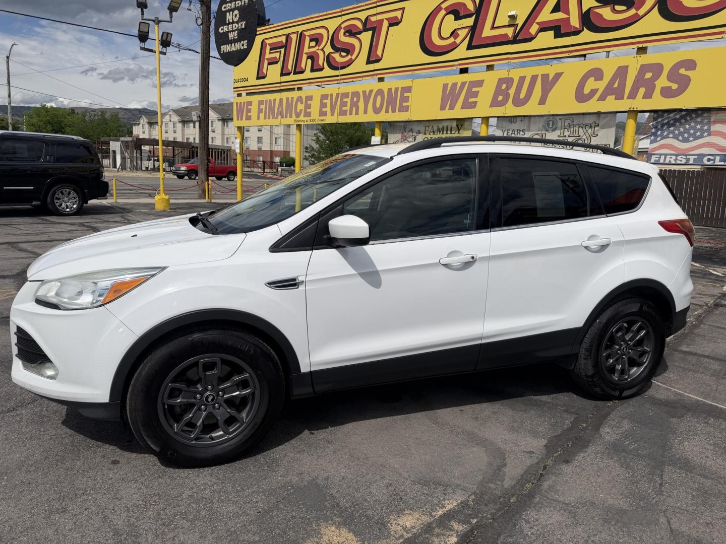 2015 Super White /Black Ford Escape SE 4WD (1FMCU9G93FU) with an 2.0L L4 DOHC 16V engine, 6-Speed Automatic transmission, located at 801 South State Street, Salt Lake City, UT, 84111, (801) 328-0098, 40.751953, -111.888206 - Clean Title! Clean Carfax! Carfax shows no accidents and only 3 previous owners. Nice dependable and fuel efficient 2015 Ford Escape SE 4x4 with the powerful turbo charged engine! Great SUV for commuting, road trips, family driving, or winter weather with plenty of cargo space and comfortable seatin - Photo#11
