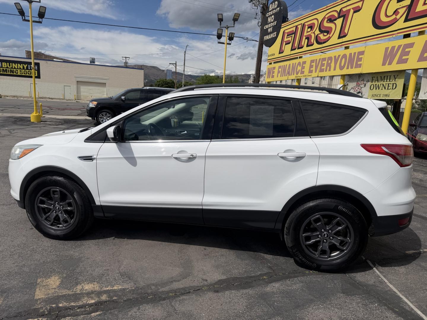 2015 Super White /Black Ford Escape SE 4WD (1FMCU9G93FU) with an 2.0L L4 DOHC 16V engine, 6-Speed Automatic transmission, located at 801 South State Street, Salt Lake City, UT, 84111, (801) 328-0098, 40.751953, -111.888206 - Clean Title! Clean Carfax! Carfax shows no accidents and only 3 previous owners. Nice dependable and fuel efficient 2015 Ford Escape SE 4x4 with the powerful turbo charged engine! Great SUV for commuting, road trips, family driving, or winter weather with plenty of cargo space and comfortable seatin - Photo#10