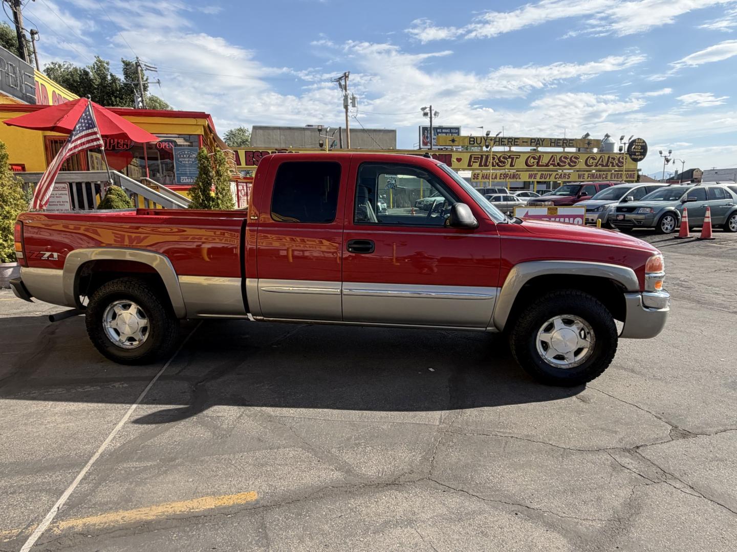 2003 Flame Red /Gray GMC Sierra 1500 Ext. Cab Long Bed 4WD (2GTEK19T031) with an 5.3L V8 OHV 16V engine, 4A OD transmission, located at 801 South State Street, Salt Lake City, UT, 84111, (801) 328-0098, 40.751953, -111.888206 - Clean title! Clean Carfax history report!!! Carfax shows no accidents vehicle has been meticulously maintained and had regular service according to Carfax!!! Approved for up to a 5 year warranty that can be added on to the vehicle you can get anywhere from a 3 month up to a 5 year warranty!!! Featu- Photo#4