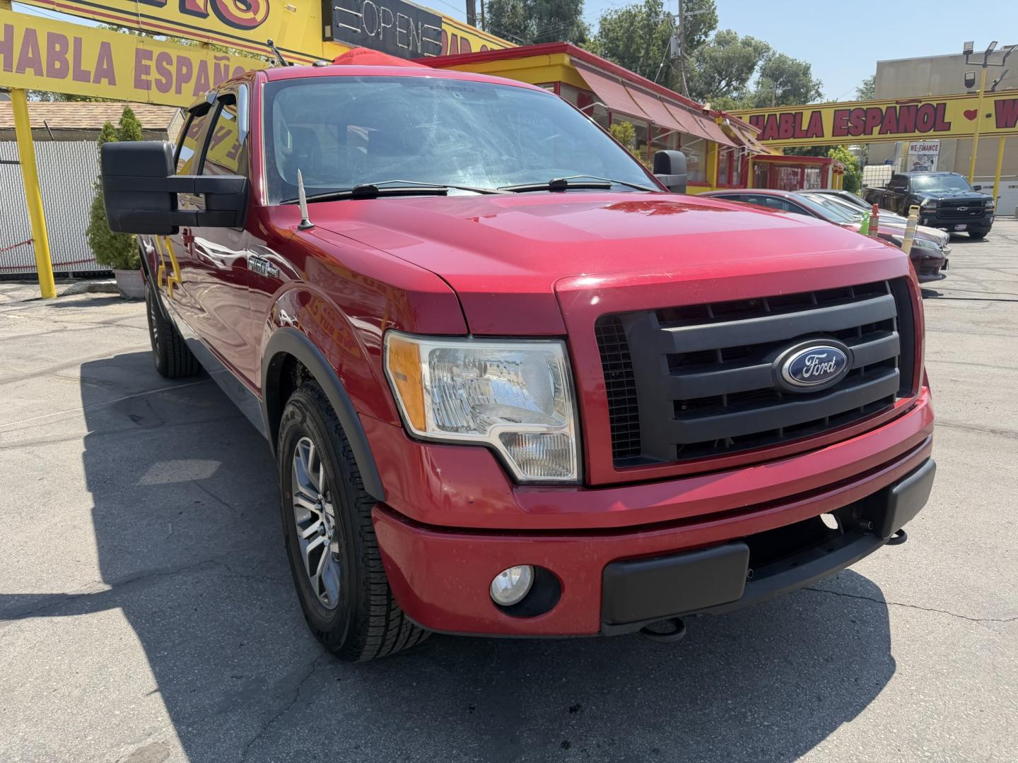 2010 Flame Red /Black Ford F-150 Lariat SuperCrew 5.5-ft. Bed 4WD (1FTFW1EV4AF) with an 5.4L V8 SOHC 24V FFV engine, 4A transmission, located at 801 South State Street, Salt Lake City, UT, 84111, (801) 328-0098, 40.751953, -111.888206 - FX4 package and 4x4. Great condition! Clean title! Low miles for the year! This truck has been regularly serviced and maintained and cared for runs and drives great!!!! Approved for up to a 5 year bumper to bumper warranty that can be added onto the vehicle. Features: 4WD/AWD, ABS Brakes, Air Cond- Photo#2