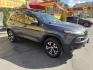 2016 Mineral Gray Metallic /Black Jeep Cherokee Trailhawk 4WD (1C4PJMBS6GW) with an 3.2L V6 DOHC 24V engine, 9A transmission, located at 801 South State Street, Salt Lake City, UT, 84111, (801) 328-0098, 40.751953, -111.888206 - Clean title no accidents on Carfax report! Perfect Jeep for winter great reliability and very good in the snow and 4x4 conditions! Includes the Trail Hawk package, roof rack and much more! Approved for up to a 5 year warranty that can be added at time of sale!!! Features: Automatic Transmission, 3.- Photo#3