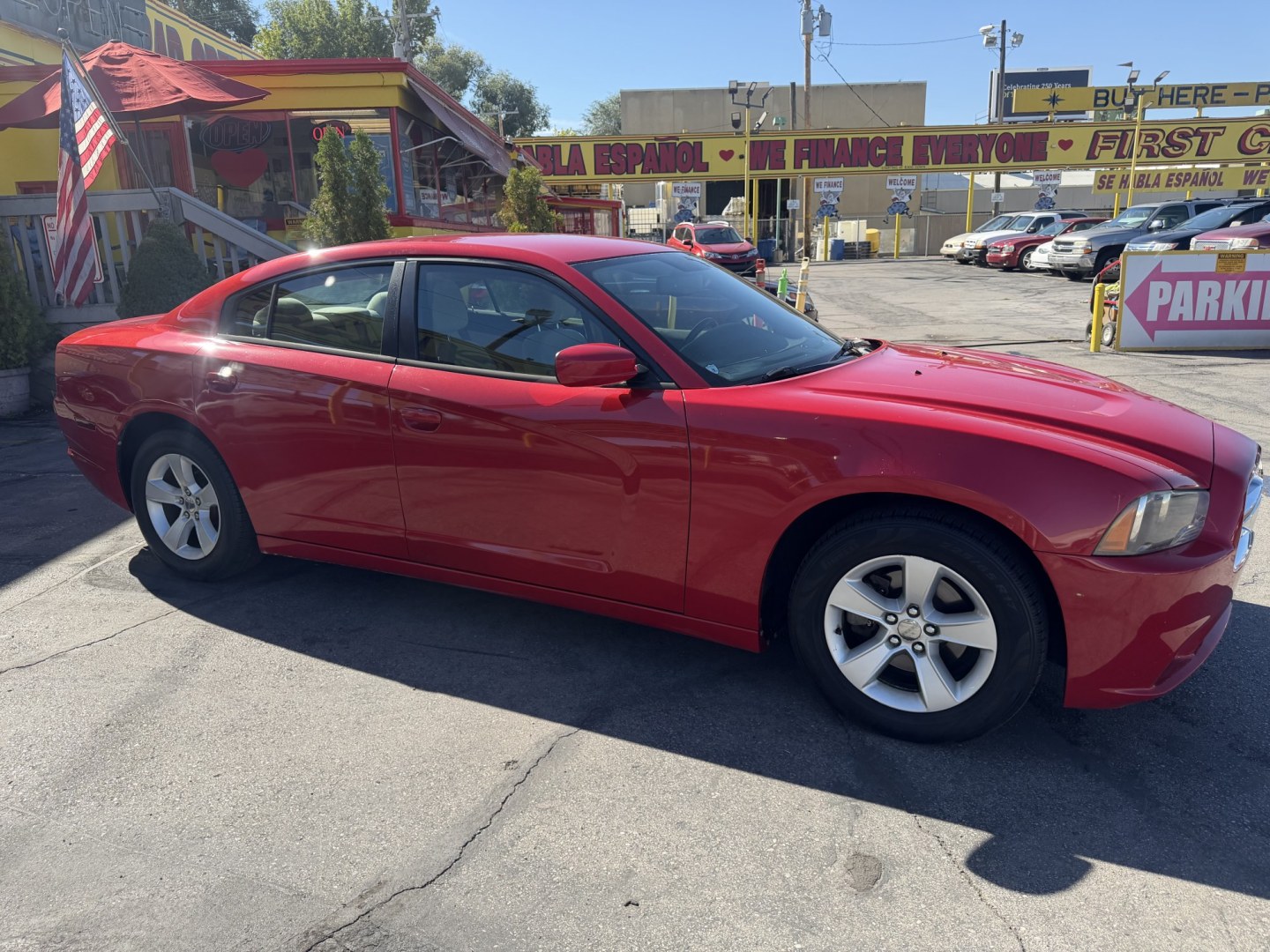 2012 Flame Red /Tan Dodge Charger SE (2C3CDXBG5CH) with an 3.6L V6 DOHC 24V engine, 5-Speed Automatic transmission, located at 801 South State Street, Salt Lake City, UT, 84111, (801) 328-0098, 40.751953, -111.888206 - Clean title! Carfax shows this vehicle has been meticulously cared for and maintained Carfax shows regular service was done and oil changes. This vehicle has passed all mechanical inspections and approved for up to a 5 year warranty that can be added at time of purchase! Features: Automatic, Alloy- Photo#4