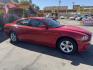 2012 Flame Red /Tan Dodge Charger SE (2C3CDXBG5CH) with an 3.6L V6 DOHC 24V engine, 5-Speed Automatic transmission, located at 801 South State Street, Salt Lake City, UT, 84111, (801) 328-0098, 40.751953, -111.888206 - Clean title! Carfax shows this vehicle has been meticulously cared for and maintained Carfax shows regular service was done and oil changes. This vehicle has passed all mechanical inspections and approved for up to a 5 year warranty that can be added at time of purchase! Features: Automatic, Alloy- Photo#4