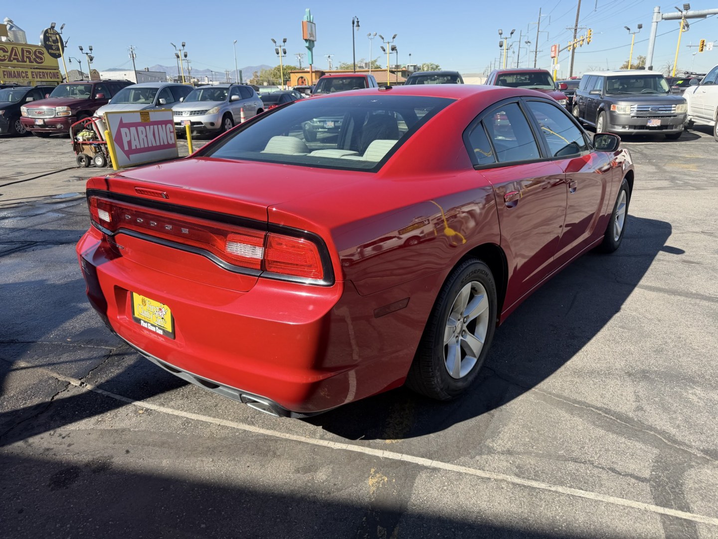 2012 Flame Red /Tan Dodge Charger SE (2C3CDXBG5CH) with an 3.6L V6 DOHC 24V engine, 5-Speed Automatic transmission, located at 801 South State Street, Salt Lake City, UT, 84111, (801) 328-0098, 40.751953, -111.888206 - Clean title! Carfax shows this vehicle has been meticulously cared for and maintained Carfax shows regular service was done and oil changes. This vehicle has passed all mechanical inspections and approved for up to a 5 year warranty that can be added at time of purchase! Features: Automatic, Alloy- Photo#6