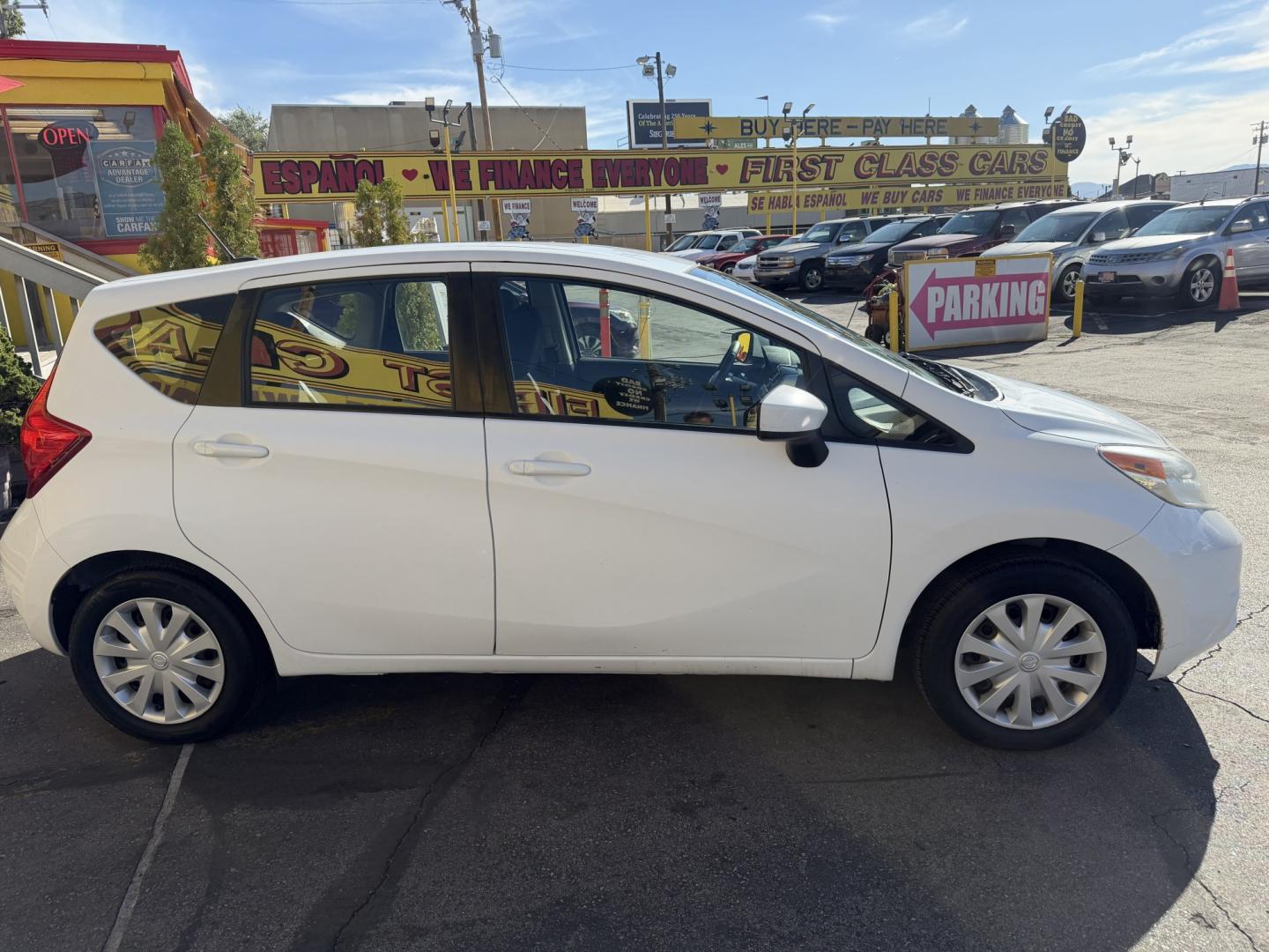 2016 Super White II /Black Nissan Versa Note S (3N1CE2CP4GL) with an 1.6L L4 DOHC 16V engine, 5M transmission, located at 801 South State Street, Salt Lake City, UT, 84111, (801) 328-0098, 40.751953, -111.888206 - Clean title! Low Miles! Great gas saver 35 MPG!!! Approved for up to a 5 year warranty that can be purchased at time of sale! Passed all mechanical inspections. Clean Carfax report only 2 previous owners on Carfax! Features: ABS Brakes, Air Conditioning, AM/FM Stereo, Automatic Transmission, Auxili- Photo#3
