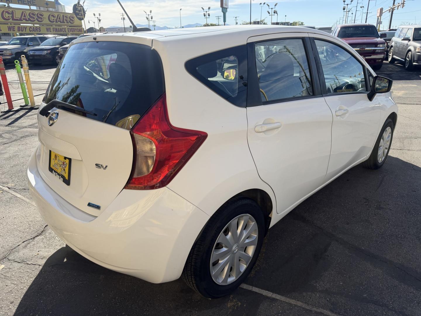 2016 Super White II /Black Nissan Versa Note S (3N1CE2CP4GL) with an 1.6L L4 DOHC 16V engine, 5M transmission, located at 801 South State Street, Salt Lake City, UT, 84111, (801) 328-0098, 40.751953, -111.888206 - Clean title! Low Miles! Great gas saver 35 MPG!!! Approved for up to a 5 year warranty that can be purchased at time of sale! Passed all mechanical inspections. Clean Carfax report only 2 previous owners on Carfax! Features: ABS Brakes, Air Conditioning, AM/FM Stereo, Automatic Transmission, Auxili- Photo#4