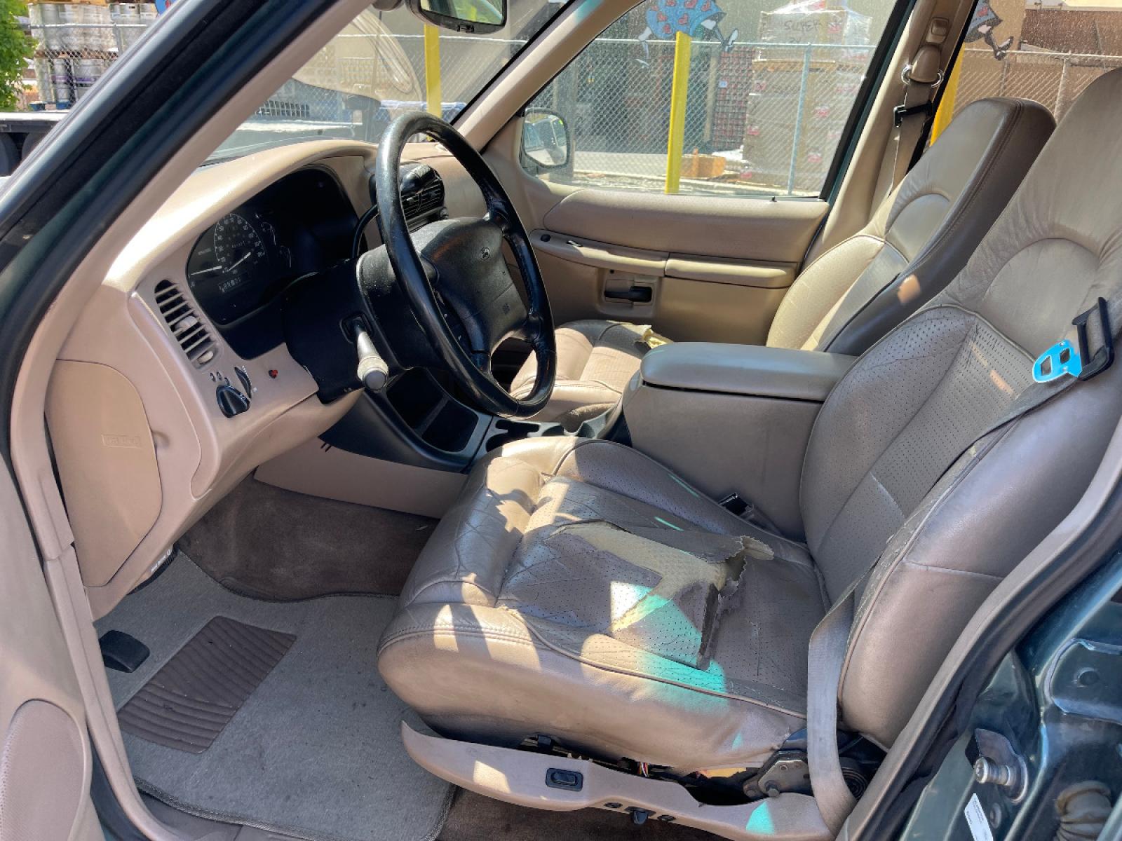 1997 Evergreen Frost Metallic /Tan Leather Ford Explorer XLT 5.0 (1FMDU35P3VZ) with an 5.0L V8 engine, Automatic transmission, located at 801 South State Street, Salt Lake City, UT, 84111, (801) 328-0098, 40.751953, -111.888206 - *MECHANIC SPECIAL! AS-IS!* BACK-LOT SPECIAL! This car just came in on trade and is being sold AS-IS. It may have mechanical or other cosmetic problems. It is being offered for sale to the public at a bargain price prior to it being sold at auction. The car has NOT been safety or emission tested nor - Photo #8