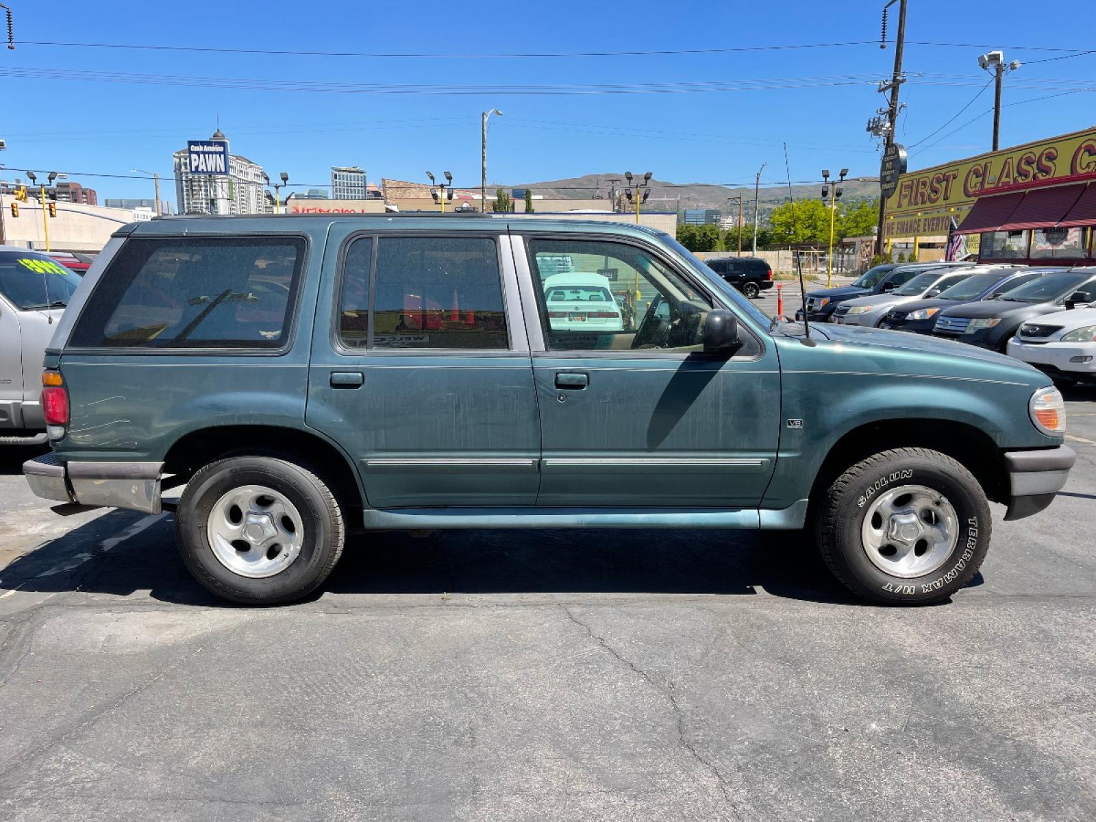 1997 Evergreen Frost Metallic /Tan Leather Ford Explorer XLT 5.0 (1FMDU35P3VZ) with an 5.0L V8 engine, Automatic transmission, located at 801 South State Street, Salt Lake City, UT, 84111, (801) 328-0098, 40.751953, -111.888206 - *MECHANIC SPECIAL! AS-IS!* BACK-LOT SPECIAL! This car just came in on trade and is being sold AS-IS. It may have mechanical or other cosmetic problems. It is being offered for sale to the public at a bargain price prior to it being sold at auction. The car has NOT been safety or emission tested nor - Photo #4