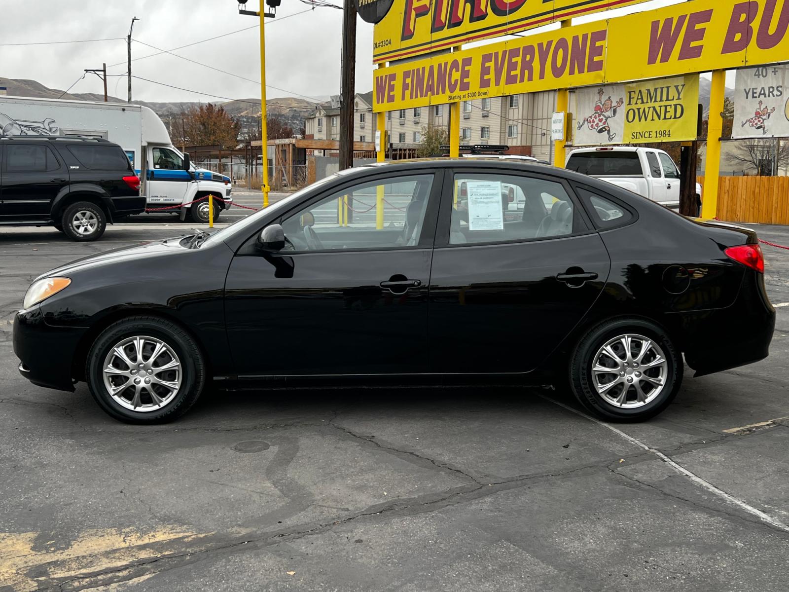 2007 Ebony Black /Gray Cloth Hyundai Elantra GLS (KMHDU46D87U) with an 2.0L I4 engine, Automatic transmission, located at 801 South State Street, Salt Lake City, UT, 84111, (801) 328-0098, 40.751953, -111.888206 - Life is crazy. Now is the time to buy! All of our prices are just dollars above our cost. These prices will change as soon as life isn't so crazy. So please call or come in. We are here to save you a lot of money! Our service department is OPEN DAILY to help with any of your service needs. P - Photo #1
