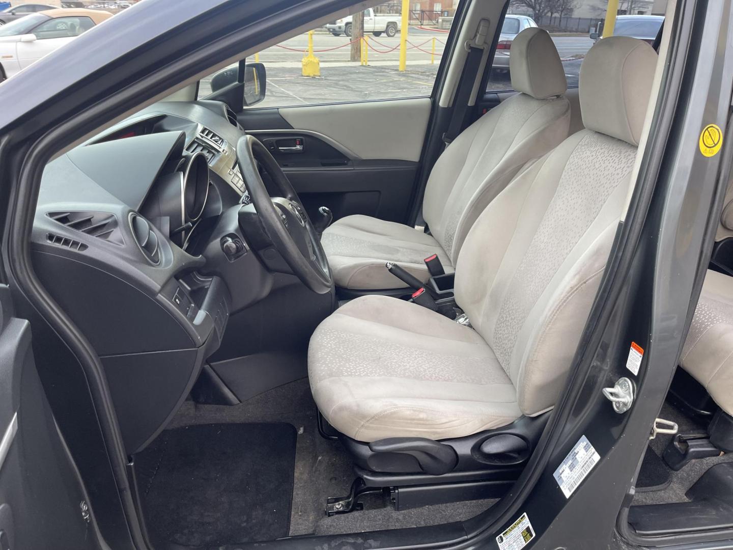 2012 Metropolitan Gray Metallic /Gray Cloth Mazda Mazda5 Sport (JM1CW2BL5C0) with an 2.5L I4 engine, Manual transmission, located at 801 South State Street, Salt Lake City, UT, 84111, (801) 328-0098, 40.751953, -111.888206 - Cool family minivan! Has sliding doors and feels like a miniature minivan. Vehicle Features: Sport Model, 3rd Rear Seat, ABS Brakes, Air Conditioning, Alloy Wheels, AM-FM Stereo, Auxiliary Audio Input, CD Audio, Cloth Seats, Cruise Control, Fold-Away Third Row, Manual Transmission, Overhead Airba - Photo#9